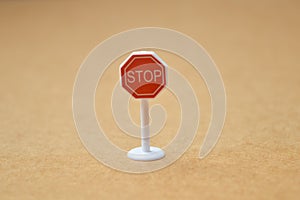 Stop sign symbol used for traffic controlling and road safety with blurred background