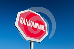 Stop sign with a text RANSOMWARE to cease malware attacks and protect against them