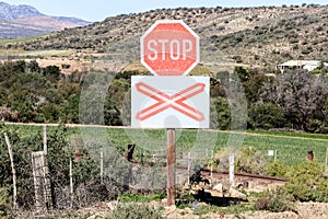 Stop sign at unguarded railway crossing photo
