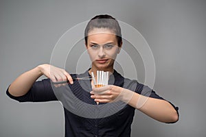 Stop smoking concept. Young woman cut cigarettes