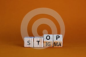 Stop stigma symbol. Turned wooden cubes with words stop stigma. Beautiful orange background. Medical and stop stigma concept. Copy photo