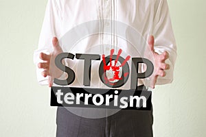 Stop terrorism concept. man holds
