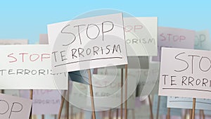 STOP TERRORISM placards at street demonstration. Conceptual loopable animation