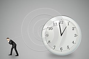 Stop timing concept with businessman trying to stop the time