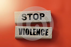 Stop violence words on Wooden building blocks on red. Stop racism concept