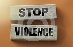 Stop violence words on Wooden building blocks on red. Stop racism concept.