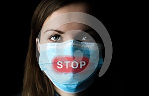 Stop the virus and epidemic diseases. Woman in medical mask on black background. Time of quarantine. Coronavirus pandemia. Virus