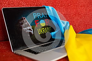 stop war and patriot. laptop, flag of ukraine