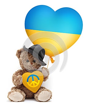 Stop war in Ukraine and humanitarian aid to refugees. Teddy bear showing a heart in the colors of the Ukrainian flag with the