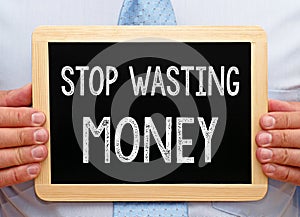 Stop wasting Money - Manager with chalkboard