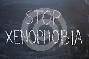 STOP XENOPHOBIA writing on a chalkboard