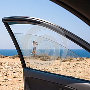 Stopover. Woman taking photo from seashore