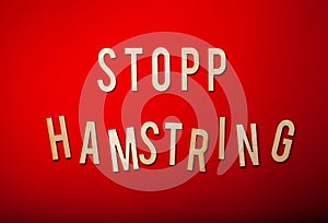 Stopp hamstring norwegian word text wooden letter on red background coronavirus covid-19