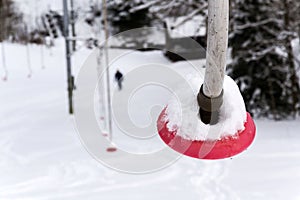 Stopped poma surface lift on abandoned empty ski slope, end of ski season and quarantine concept, Krkonose mountains