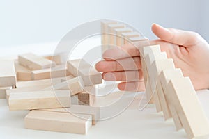 Stopping the domino effect concept with a business solution and intervention photo