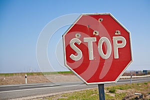 Stopsign with bullet hole