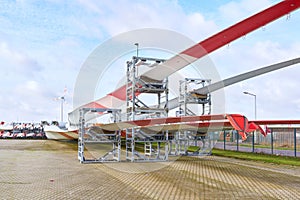 Storage area for wind turbine rotor blades in an industrial area