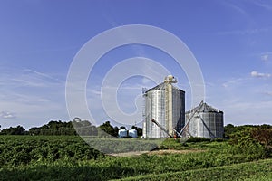 Storage bins next to a cotton field