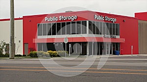 storage building public storage in white writing on orange background-
