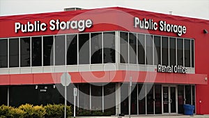 storage building public storage in white writing on orange background-