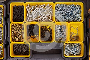 Storage case with screws, nuts, bolts, nails and other small tools for repairer, top view