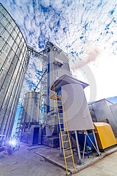 Storage construction silo tanks. Huge metal industrial containers.