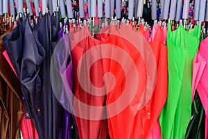 Storage of different colors umbrella. Colorful umbrellas background.