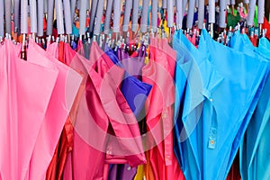 Storage of different colors umbrella. Colorful umbrellas background.