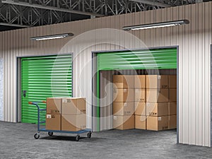 storage hall with open storages door and wheelbarrow with boxes