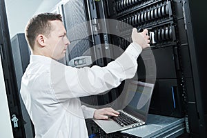 Storage maintenance. Service engineer in server room