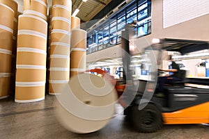 Storage of paper rolls in a large print shop - transport with a forklift truck