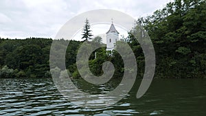 Storage reservoir Velka Domasa, church on the lake, river Ondava, Slovakia