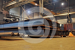 Storage of rolled metal in a warehouse.