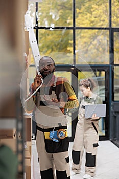 Storage room worker discussing goods stock supply