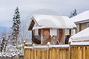 Storage sheld on back yard in snow