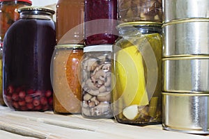 Storage shelves in pantry with homemade canned preserved fruits and vegetables