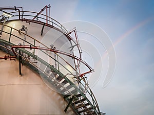 Storage tank petrochemical and rainbow background