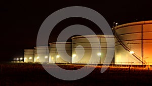 White tanks in tank farm with blue sky