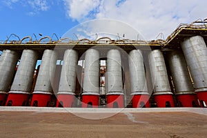 Storage tanks and pipes at alumina processing plant