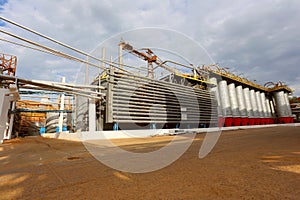 Storage tanks and pipes at alumina processing plant
