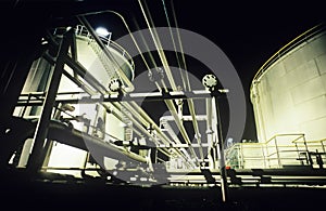 Storage tanks and pipes petrochemical oil refinery photo