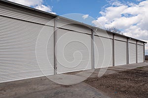 Storage units with roller shutter doors in industrial area