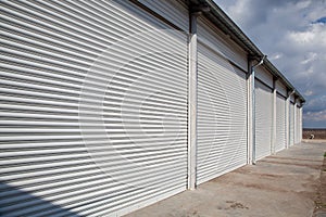 Storage units with roller shutter doors in industrial area