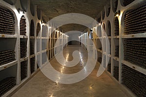 The storage of wine bottles in a wine cellar.