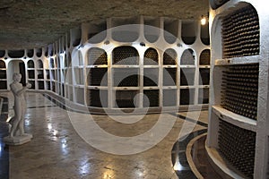 The storage of wine bottles in a wine cellar.