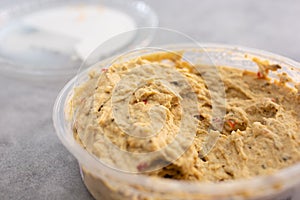 store-bought hummus container