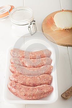 Store bought uncooked meat sausages photo