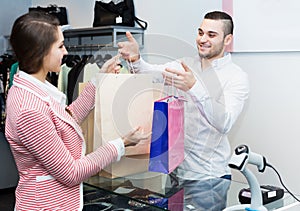 Store clerk serving purchaser