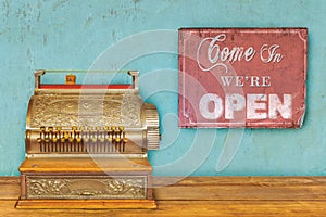 Store concept with cash register and open sign