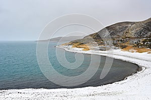 The store of Holy Rakshas Tal lake in snowfall, Western Tibet, China. This lake also known as Demons Lake, Ravana Tal or Ravan Ha